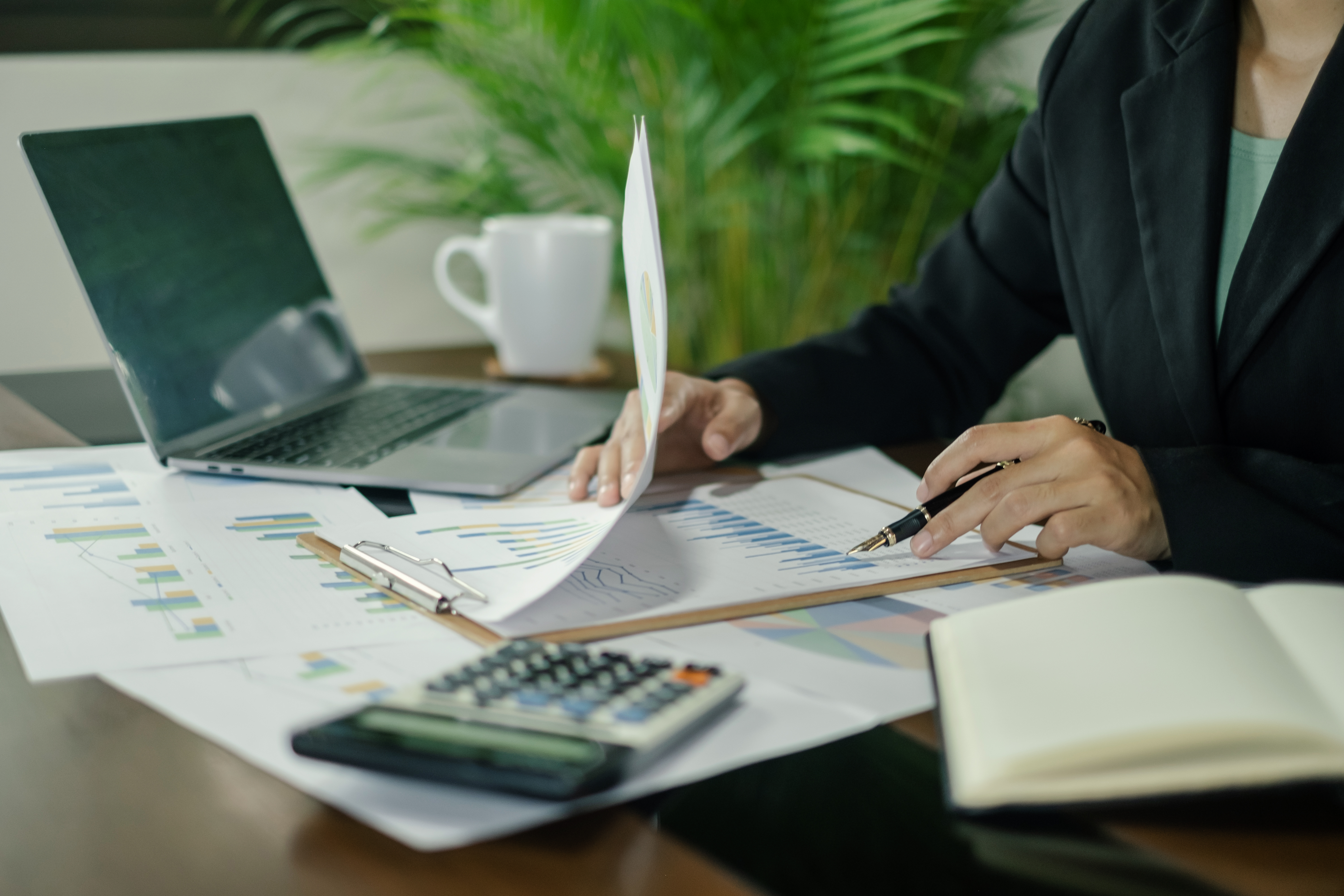 Accountant reviewing financial reports at desk